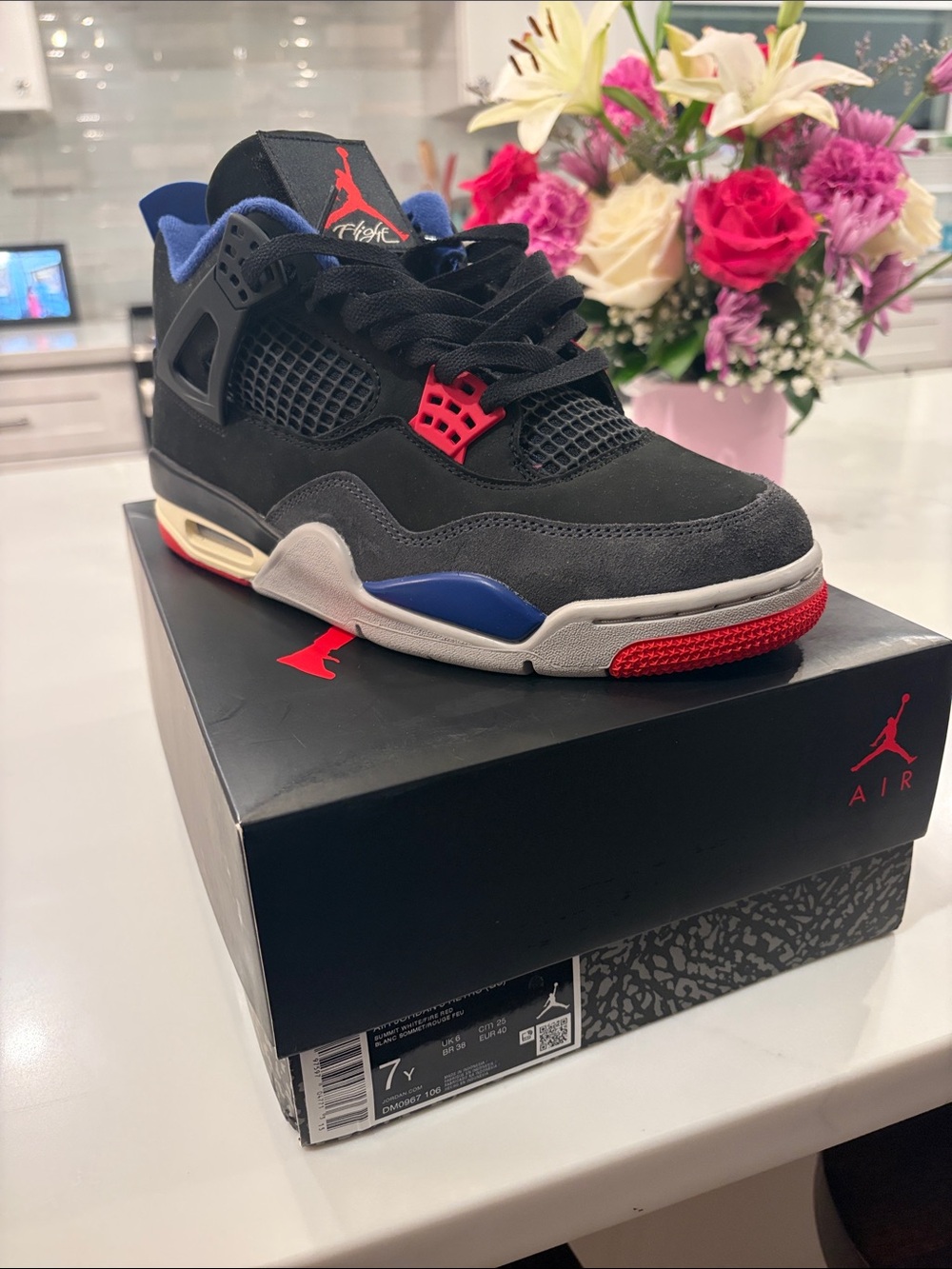 Jordan 4 Retro Black with Blue and Red Accents - Men’s Sneaker